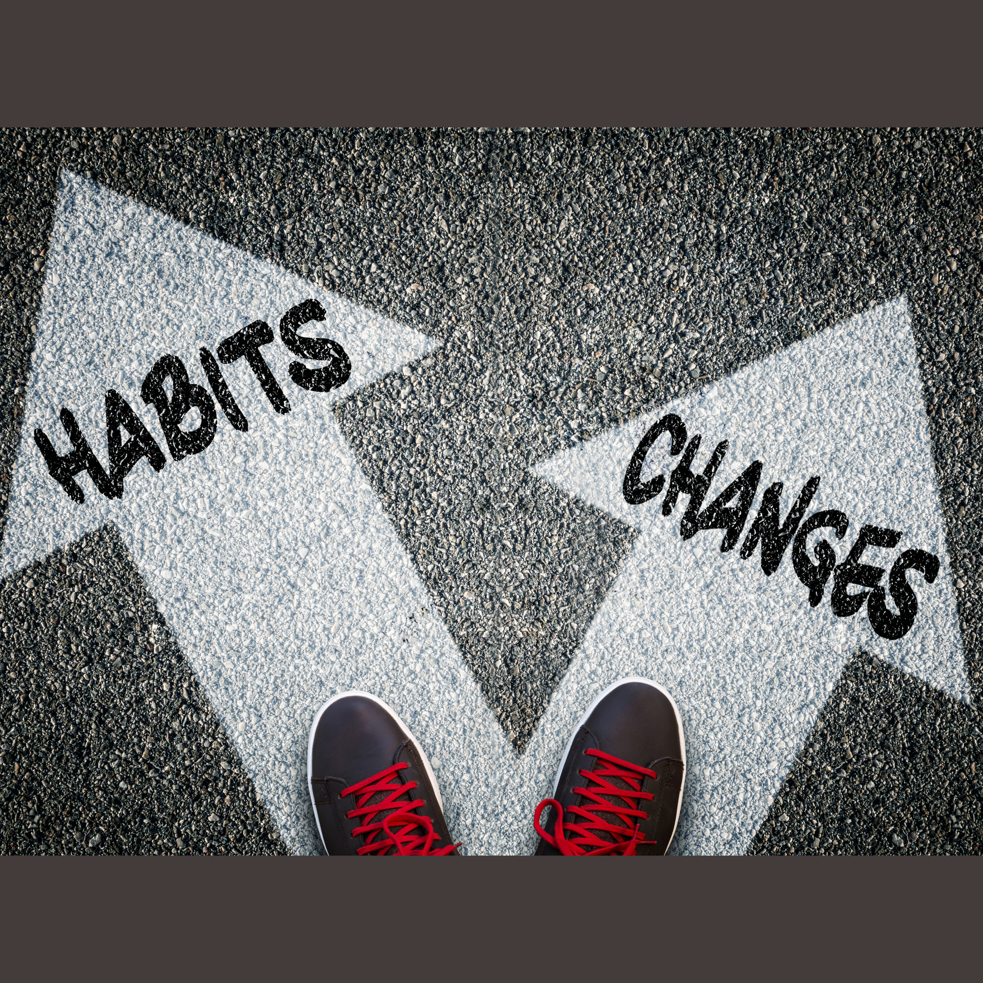 A photo looking down on a road with a view of someone's sneakers in front of two arrows, one labeled "habits" and one labeled "changes."