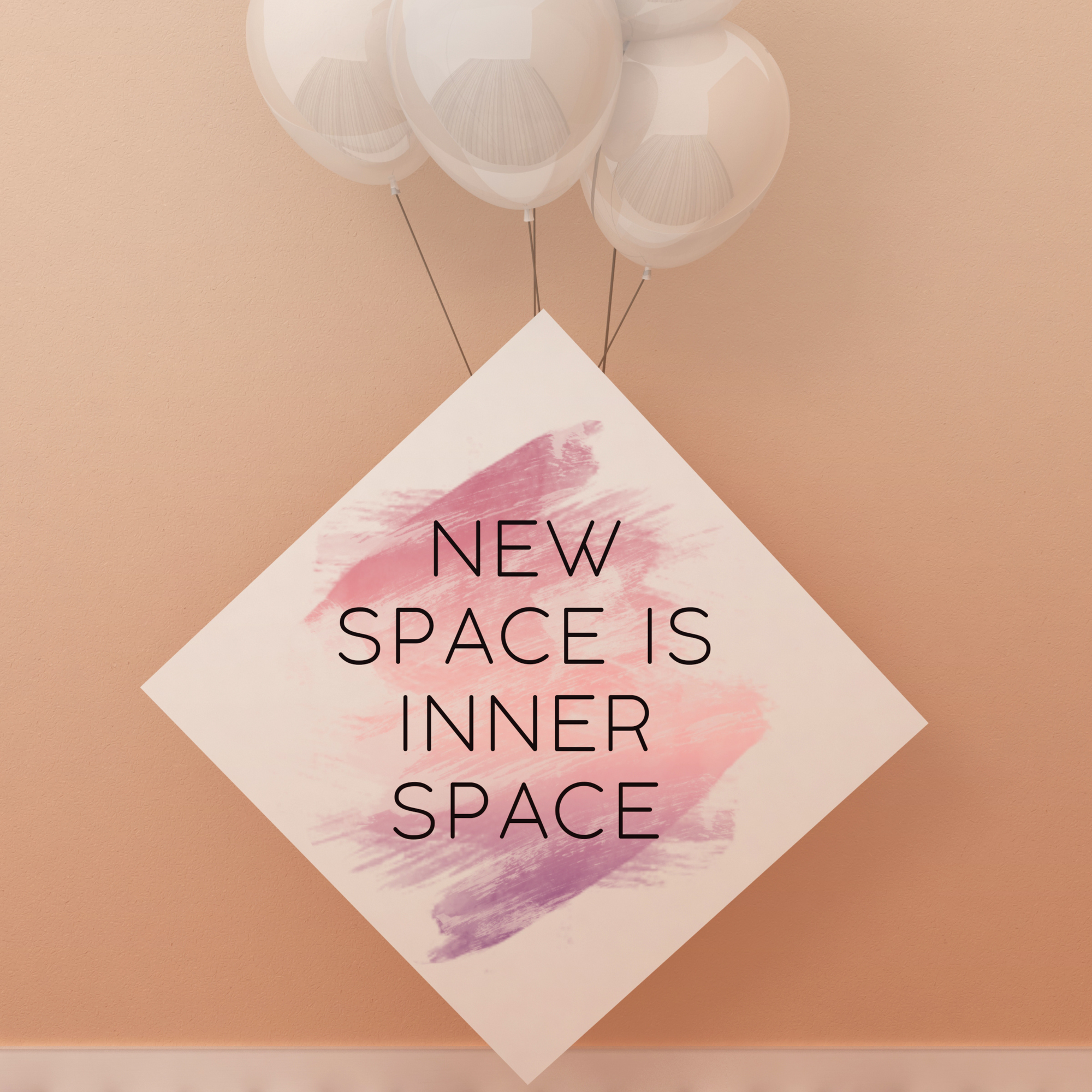 photo of white balloons anchored by a sign that reads "new space is inner space"